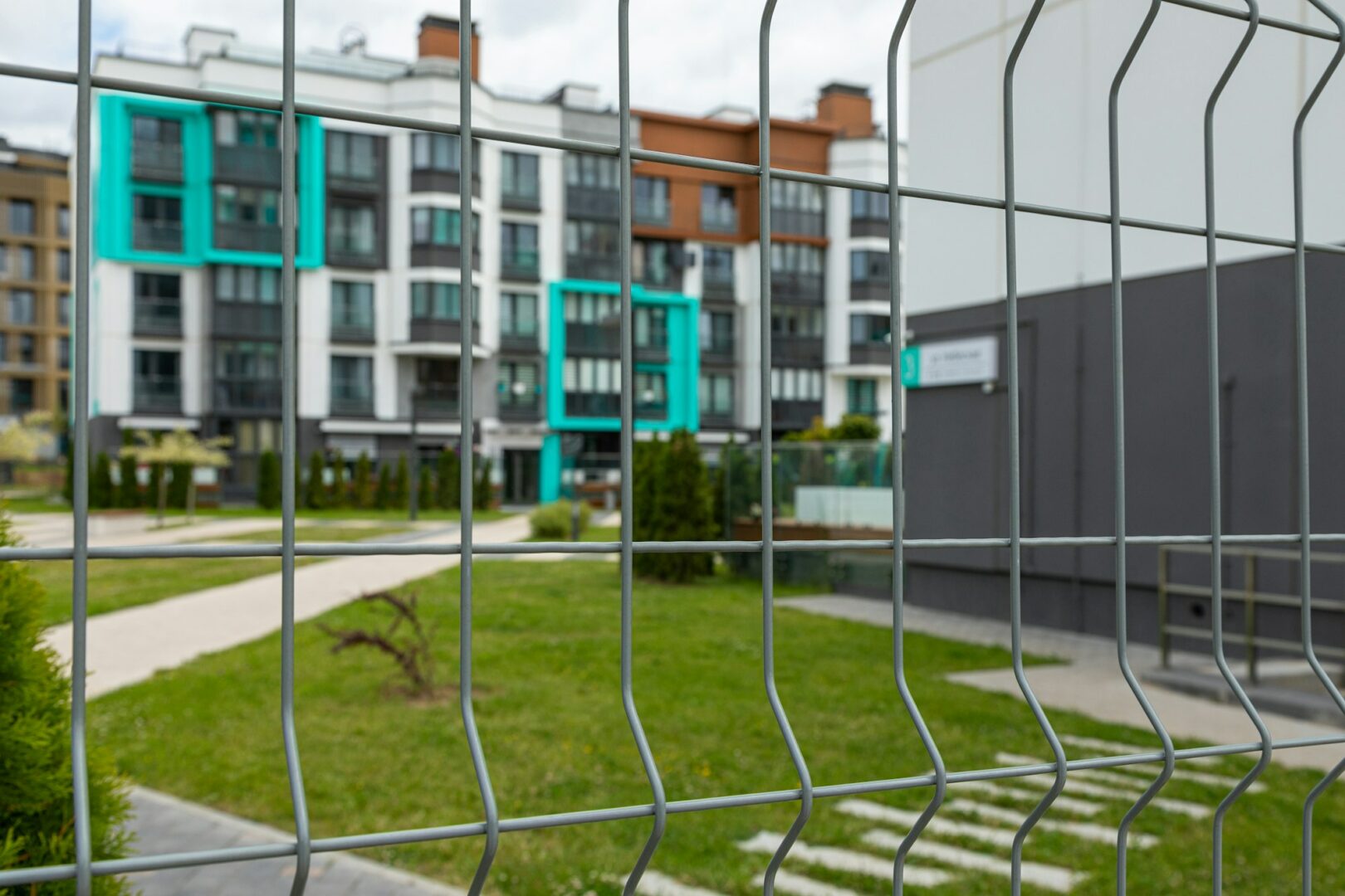 Specimesh fence enclosing a park area, offering protection and an aesthetic touch.